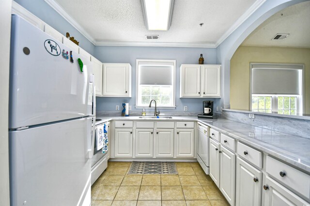 6015 Catalina Dr Unit 431, North Myrtle Beach, SC 29582 - kitchen featuring a wealth of natural light, visible vents, a sink, and white appliances