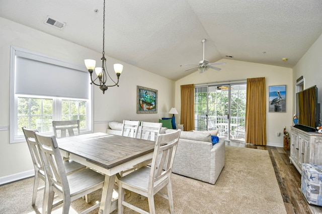 6015 Catalina Dr Unit 431, North Myrtle Beach, SC 29582 - dining space with ceiling fan with notable chandelier, a textured ceiling, visible vents, lofted ceiling, and dark wood-style floors