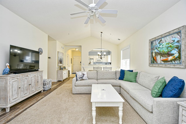 6015 Catalina Dr Unit 431, North Myrtle Beach, SC 29582 - living area with vaulted ceiling, ceiling fan with notable chandelier, arched walkways, and wood finished floors
