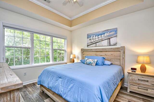 6015 Catalina Dr Unit 431, North Myrtle Beach, SC 29582 - bedroom featuring baseboards, ornamental molding, ceiling fan, and wood finished floors
