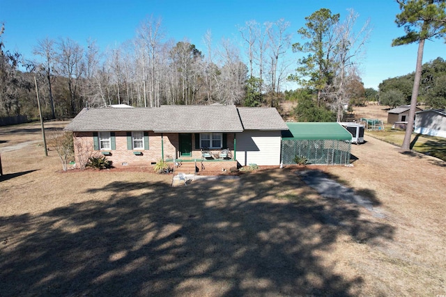 view of front facade featuring a carport and covered porch