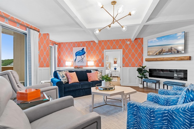 living room featuring a wainscoted wall, coffered ceiling, light wood-style flooring, and wallpapered walls