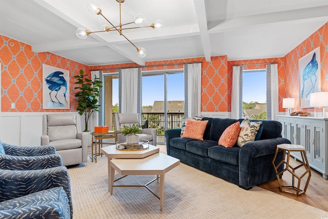 living room with light wood-style floors, beam ceiling, a wainscoted wall, and wallpapered walls