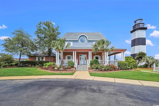 view of front of property with a front lawn and a porch