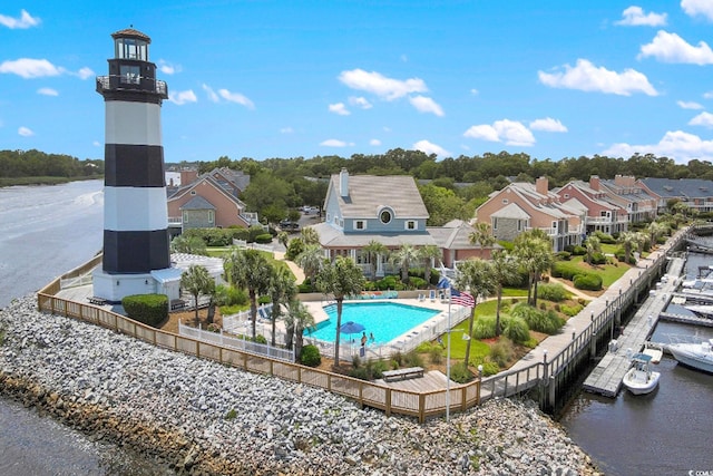 view of swimming pool featuring a water view