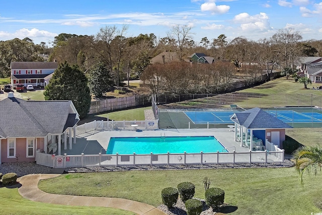 view of pool featuring a lawn and a patio area