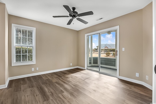 unfurnished room with ceiling fan and wood-type flooring