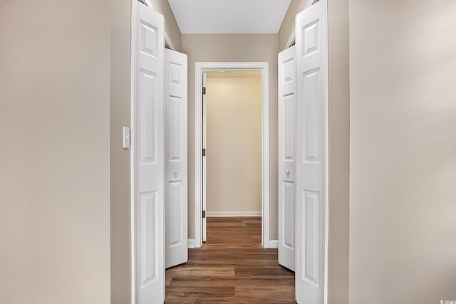 hallway featuring dark hardwood / wood-style flooring