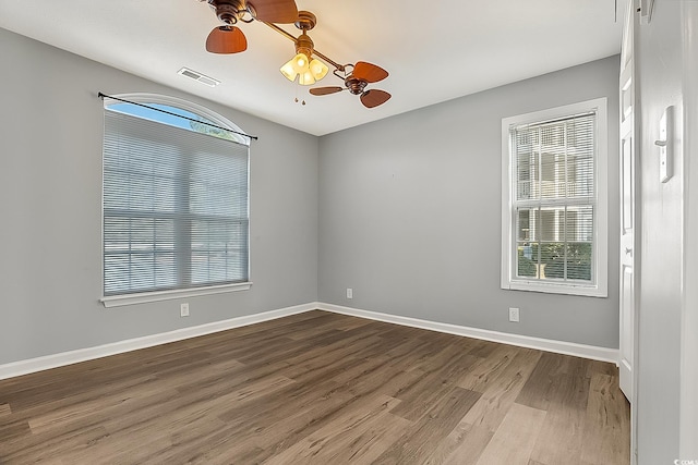 spare room with ceiling fan and hardwood / wood-style floors