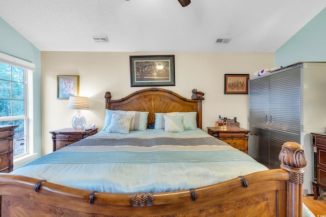 6716 Wisteria Dr, Myrtle Beach, SC 29588 - bedroom with ceiling fan, wood finished floors, and visible vents