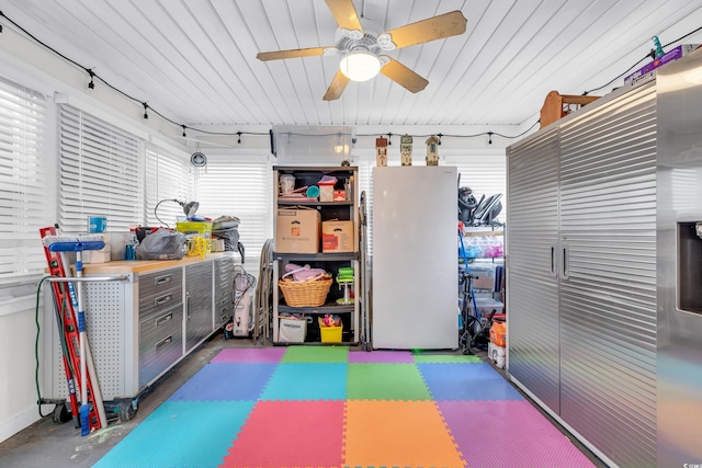 recreation room featuring concrete flooring and a ceiling fan