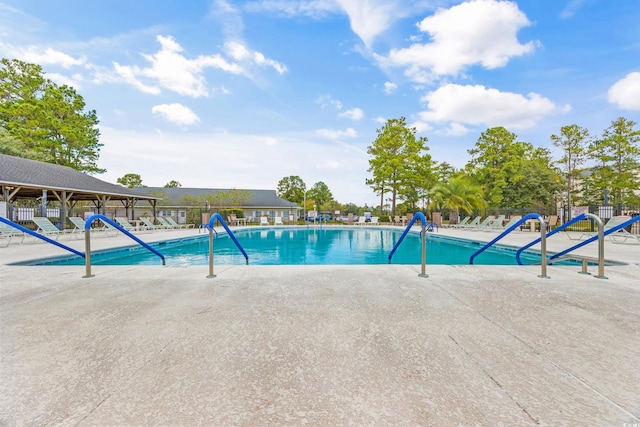 6716 Wisteria Dr, Myrtle Beach, SC 29588 - community pool featuring a patio and fence