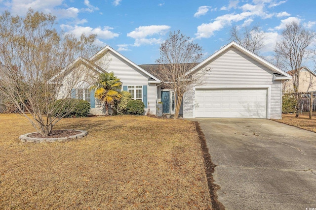 view of front of home with a garage and a front lawn