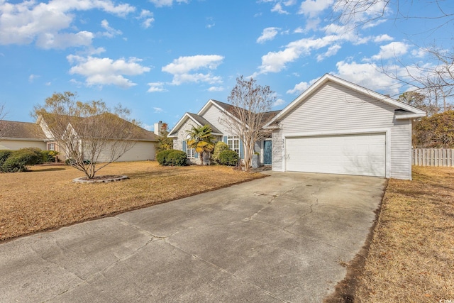 view of front of home featuring a garage and a front yard