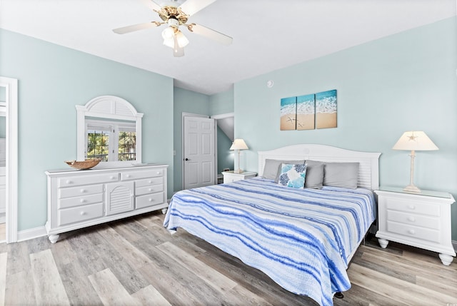 bedroom featuring baseboards, a ceiling fan, and wood finished floors