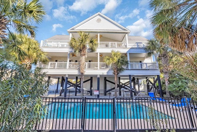 community pool featuring a patio and fence