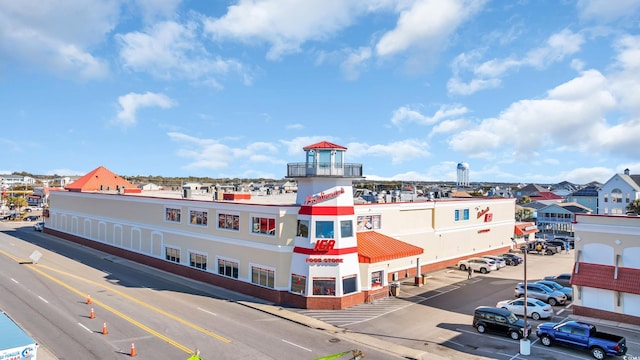 view of property with uncovered parking