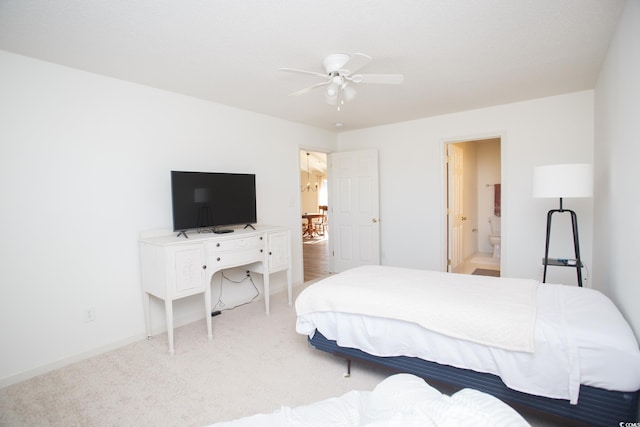 carpeted bedroom with ceiling fan and ensuite bathroom