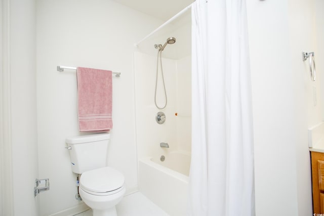 full bathroom with vanity, shower / bath combo with shower curtain, and toilet