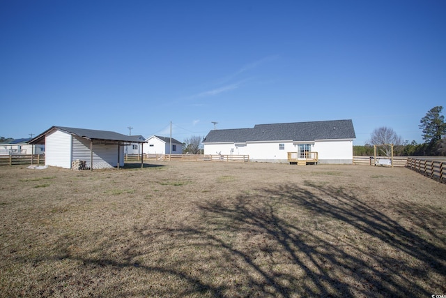 back of property featuring a yard