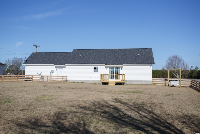 rear view of house with a wooden deck