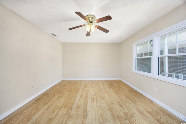 7602 Porcher Dr Unit C, Myrtle Beach, SC 29572 - empty room featuring baseboards, visible vents, a ceiling fan, and light wood finished floors
