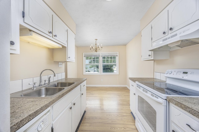 7602 Porcher Dr Unit C, Myrtle Beach, SC 29572 - kitchen featuring under cabinet range hood, white cabinetry, a sink, and electric range