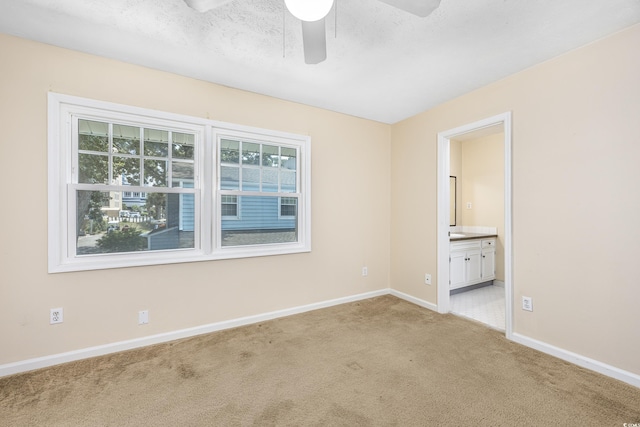 7602 Porcher Dr Unit C, Myrtle Beach, SC 29572 - empty room with light carpet, baseboards, ceiling fan, and a textured ceiling