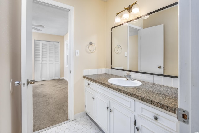7602 Porcher Dr Unit C, Myrtle Beach, SC 29572 - bathroom with baseboards, ceiling fan, and vanity