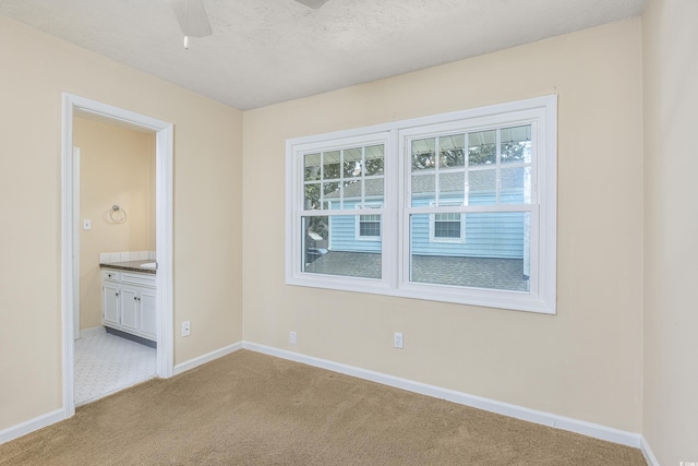 7602 Porcher Dr Unit C, Myrtle Beach, SC 29572 - spare room with plenty of natural light, light colored carpet, baseboards, and a ceiling fan