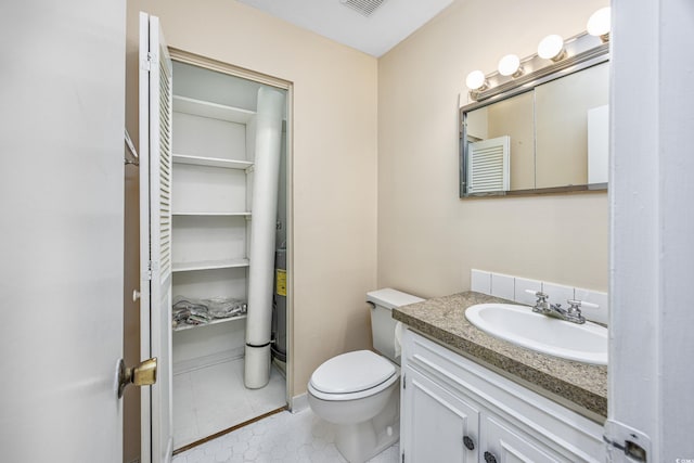 7602 Porcher Dr Unit C, Myrtle Beach, SC 29572 - half bath with toilet, tile patterned flooring, and vanity