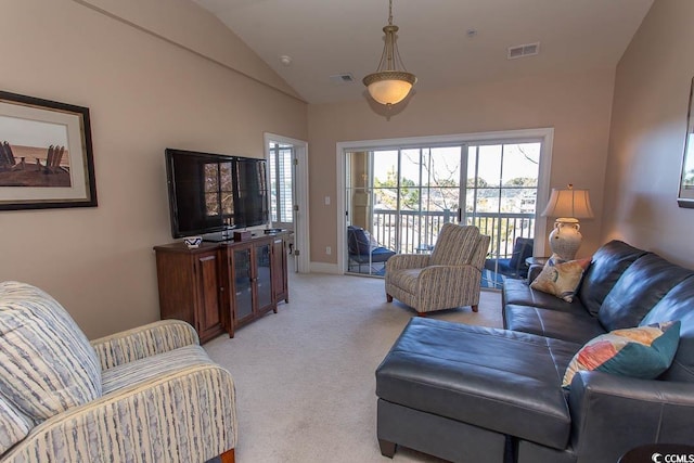 carpeted living room featuring vaulted ceiling