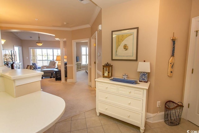 interior space featuring ornamental molding, tile patterned flooring, and ornate columns