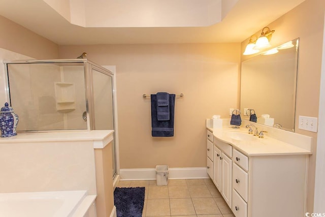 bathroom with vanity, tile patterned floors, and a shower with door