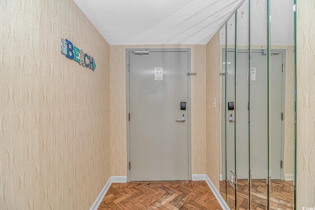 doorway to outside with light parquet floors