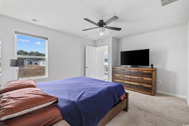 bedroom featuring ceiling fan and light colored carpet