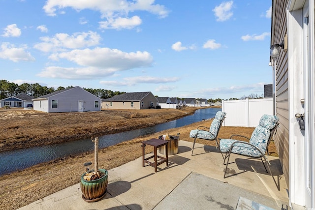 view of patio with a water view