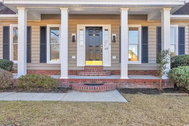 entrance to property featuring a porch