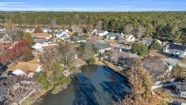 birds eye view of property with a residential view, a water view, and a forest view