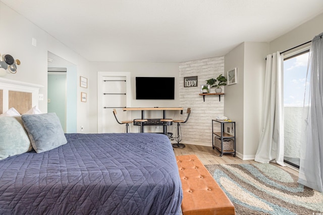 bedroom with light wood-type flooring