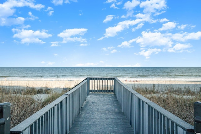 view of home's community featuring a view of the beach and a water view