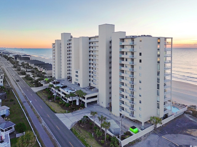 outdoor building at dusk featuring a water view