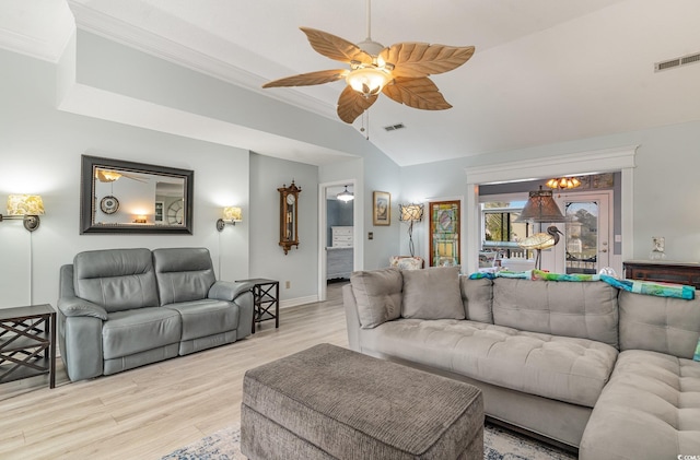 living room with ceiling fan, ornamental molding, vaulted ceiling, and light hardwood / wood-style flooring