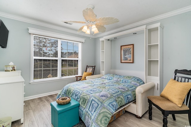 bedroom with crown molding, ceiling fan, and light wood-type flooring