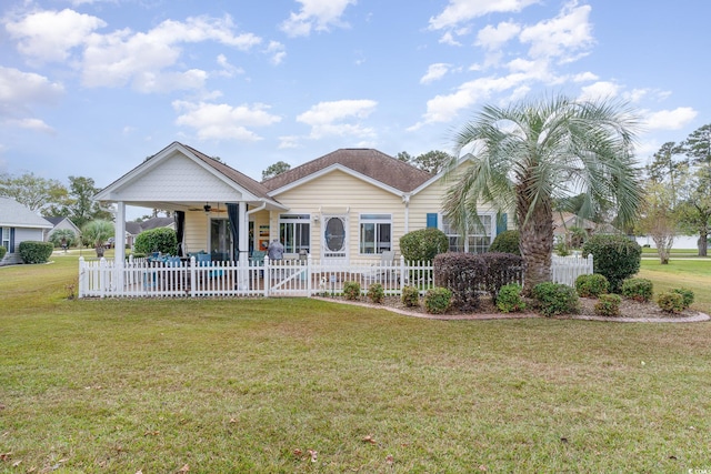 ranch-style house with ceiling fan and a front lawn