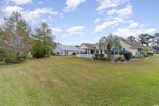 view of yard featuring covered porch