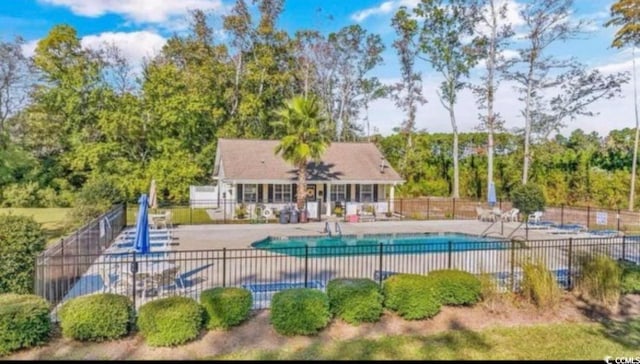 view of swimming pool with a patio area