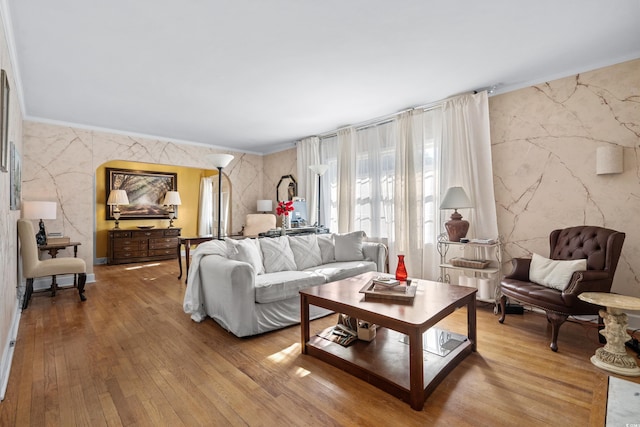 living room featuring wood-type flooring and ornamental molding