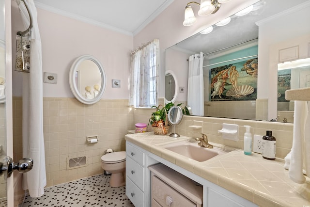 bathroom with crown molding, tile walls, vanity, and toilet