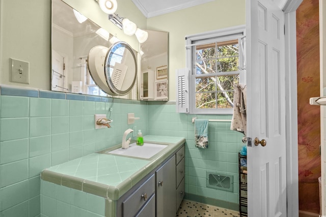 bathroom featuring ornamental molding, vanity, and tile walls